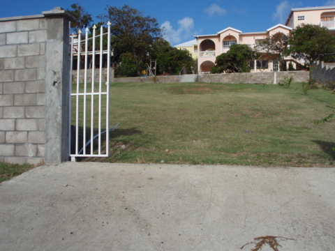/i//entrance_to_lot_with_sliding_gate_in_open_position.jpg
